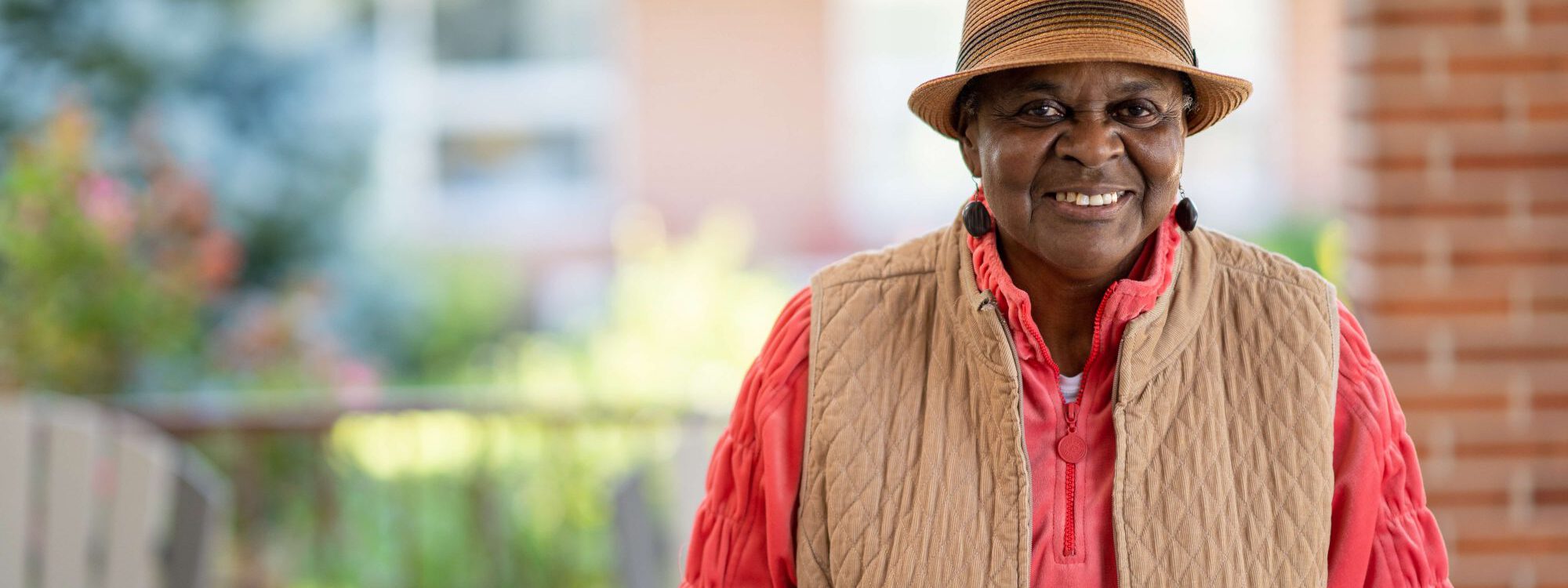 Lutheran Life Villages Assisted Living Tabitha Lutheran Life Villages resident Tabitha, smiling outside enjoying the nice weather