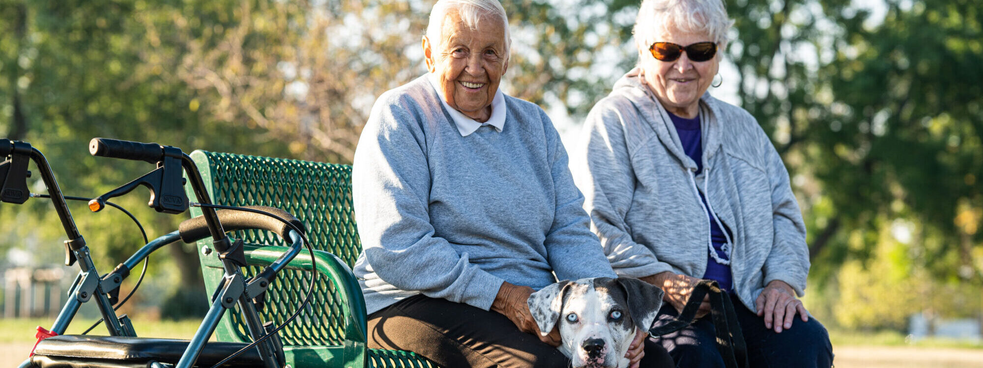 DSC01299 two lutheran life villages residents outside sitting on a bench
